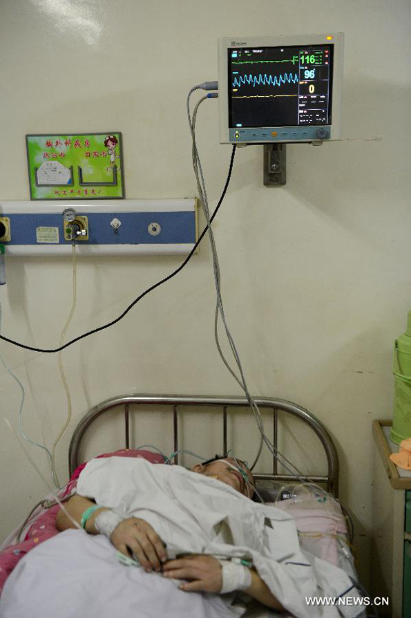 Jin Jigang, who is wounded in a blast, receives treatment in a hospital in Shuangyashan City, northeast China&apos;s Heilongjiang Province, Jan. 11, 2013. 