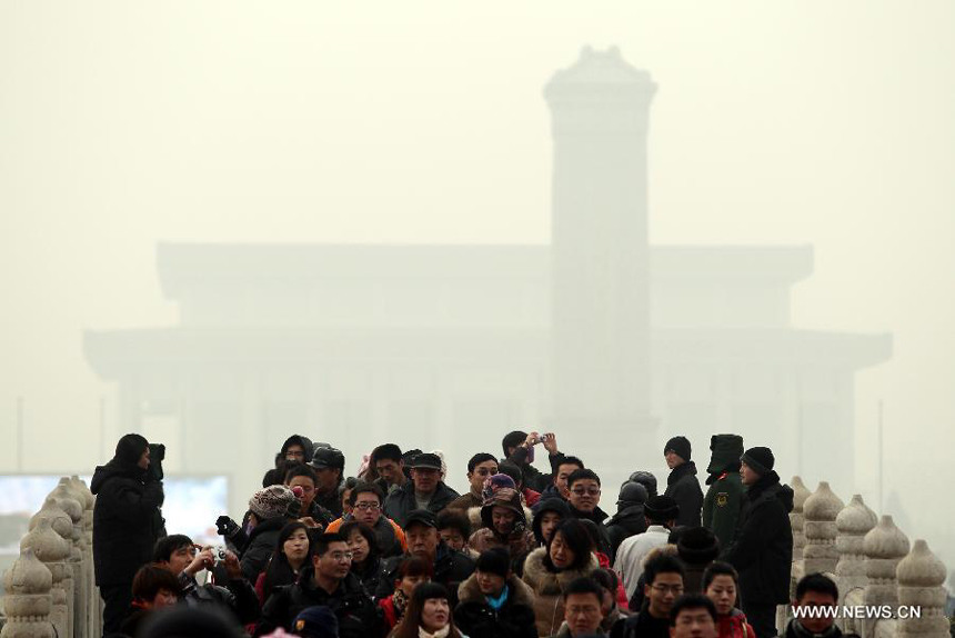 People visit the Tian&apos;anmen Square in Beijing, capital of China, Jan. 11, 2013. The PM 2.5 (particles less than 2.5 microns) data in Beijing hit 240 to 446 on Friday, which means the 6 rating heavily polluted air quality.