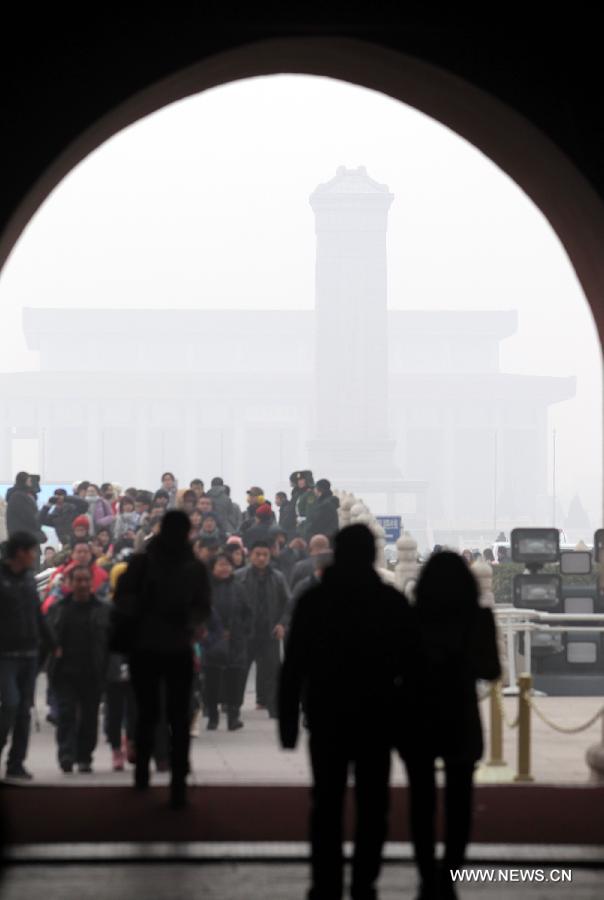 People visit the Tian&apos;anmen Square in Beijing, capital of China, Jan. 11, 2013. The PM 2.5 (particles less than 2.5 microns) data in Beijing hit 240 to 446 on Friday, which means the 6 rating heavily polluted air quality. 