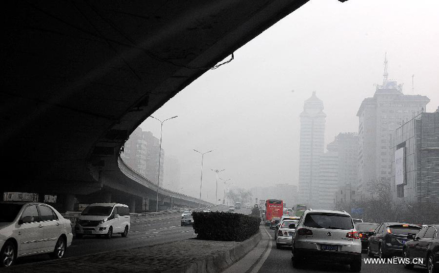 Buildings are wrapped up by haze in Beijing, capital of China, Jan. 11, 2013. The PM 2.5 (particles less than 2.5 microns) data in Beijing hit 240 to 446 on Friday, which means the 6 rating heavily polluted air quality. 
