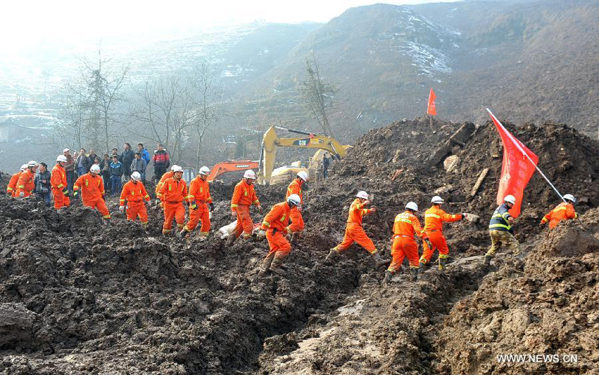 Rescuers leave a landslide spot in Zhenxiong mountain of Zhaotong City, southwest China's Yunnan Province, Jan. 12, 2012. The rescue of a landslide which hit the Zhaojiagou area of Gaopo Village early Friday finished after all 46 bodies were retrieved Saturday.