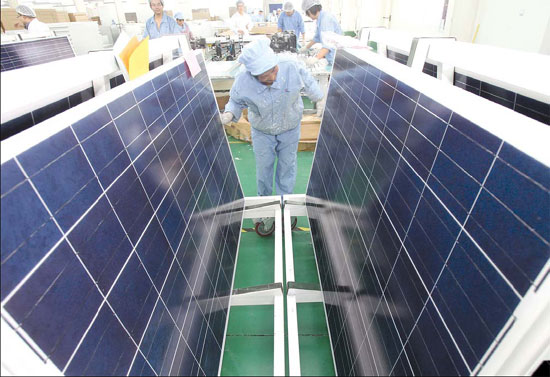 Workers checking the quality of solar panels at a PV solar factory in Jiangsu province. For the Chinese solar industry, the path to its largest overseas market - Europe - is increasingly narrowing because the European Union has started anti-dumping and anti-subsidy investigations on made-in-China solar products. [Photo/China Daily]