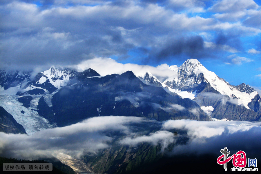 Meili Snow Mountain is a mountain range in the Chinese province of Yunnan. Meili Snow Mountain has long been famous for its main peak, Kang Karpo Peak, the highest peak in Yunnan, with an elevation of 6,740 meters (22,112 feet) above sea level. The peak, meaning White Snow Mountain in Tibetan language, is extolled as the 'most beautiful mountain in the world.' [Photo/China.org.cn] 