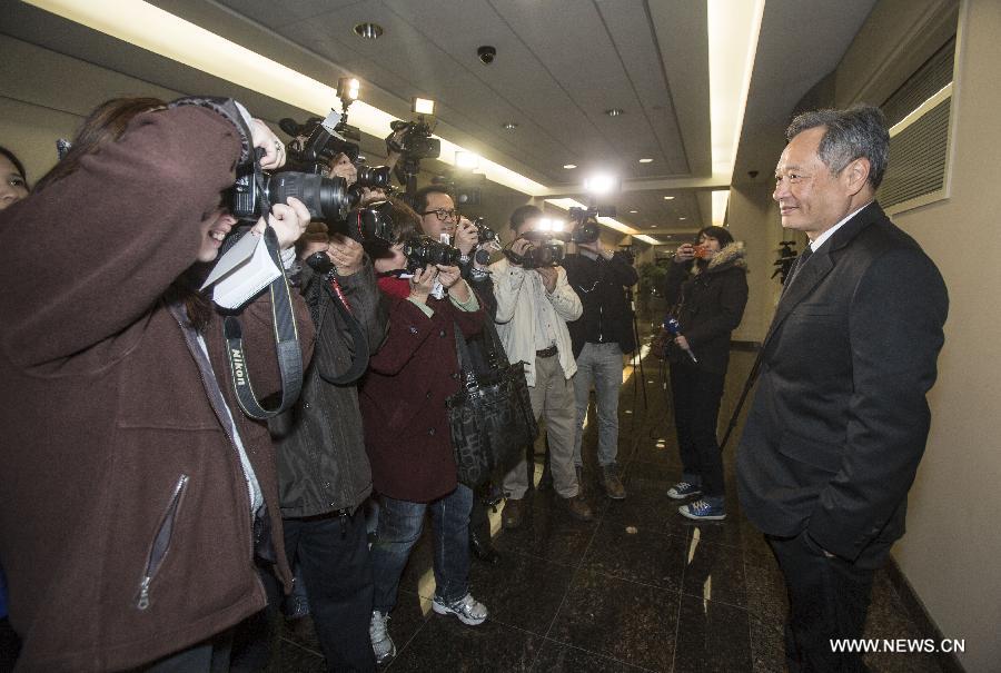 Director Ang Lee (R) receives interviews in Los Angeles, the United States, on Jan. 13, 2013. Composer Michael Danna won for best original score of the 70th Golden Globe Awards for composing the melody of Ang Lee's 3-D fantasy film 'Life of Pi'. [Xinhua]