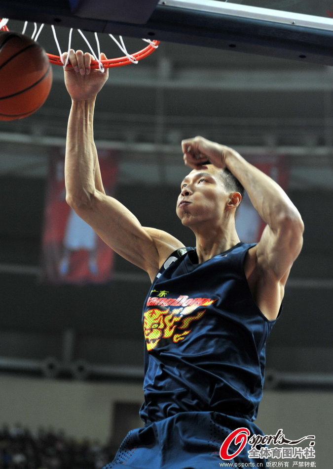 Yi Jianlian of Guangdong slams dunk during a CBA match between Guangdong and Foshan on Jan.22, 2013. 