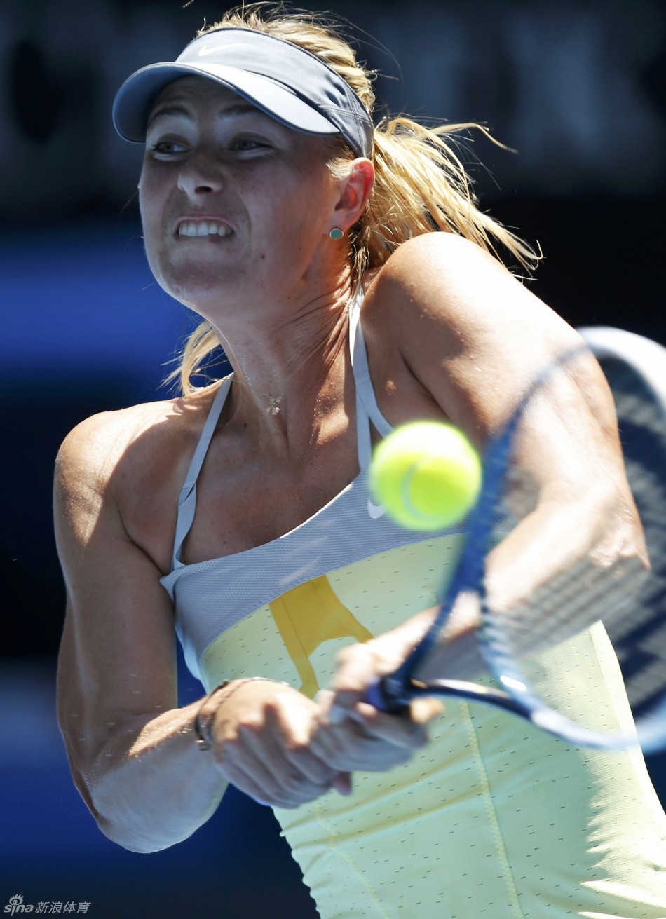 Maria Sharapova returns a ball to Li Na of China during women's singles semi-final of Australian Open at Rod Laver Arena on Jan.24, 2013.