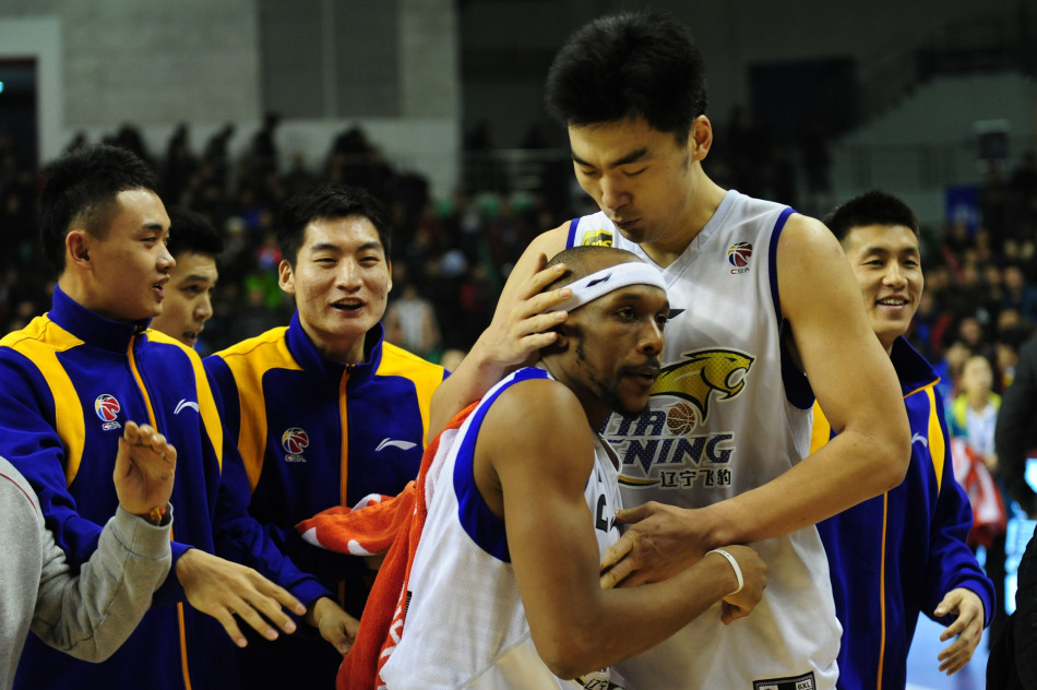Liaoning players celebrate after Josh Akognon hits the winner in a CBA game between Liaoning and Jiangsu on Jan.27, 2013.