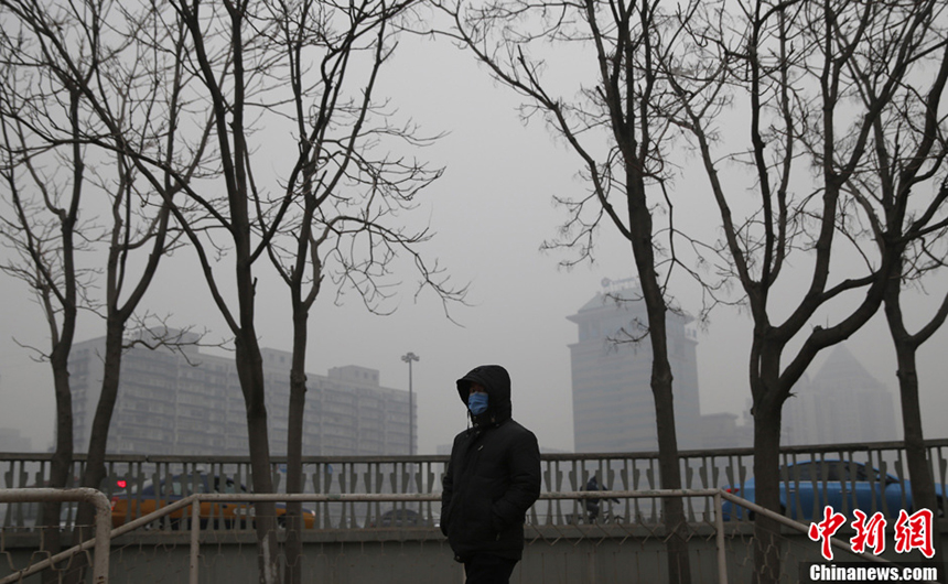 Beijing is shrouded by heavy fog on Jan. 28, 2013. The National Meteorological Center issued a blue-coded alert on Jan. 27 as foggy weather forecast for the coming two days will cut visibility and worsen air pollution in some central and eastern Chinese cities. 