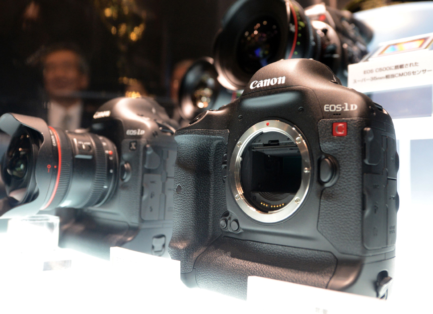 Canon&apos;s new SLR EOS D1-C DLSR Camera with 4K video recording (R) and D1-X SLR camera (L) are displayed during the CP+, (CP plus) photo imaging show in Yokohama on January 31, 2013. Around 96 companies are participating in the exhibition with some 70,000 visitors expected in the four-day-long event. 