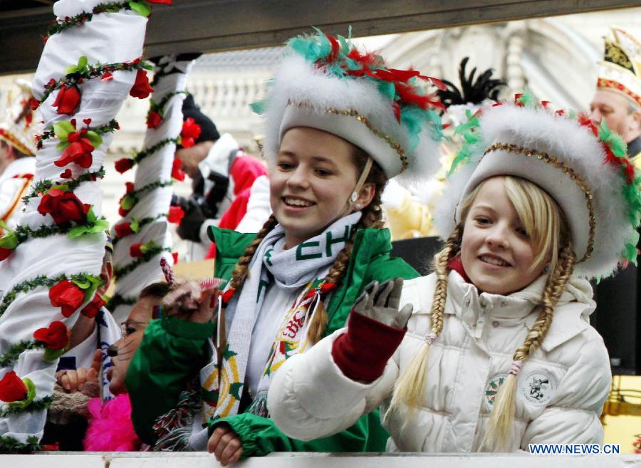 People in flamboyant costumes take part in the grand procession of the 13th Berliner Fasching Parade in Berlin Feb. 3, 2013. 