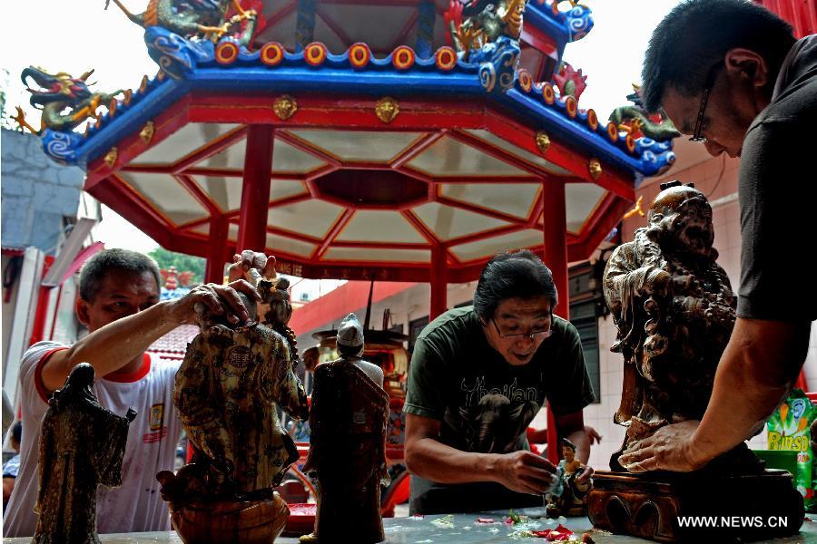 Buddha cleaned in Indonesia for the Chinese Lunar New Year