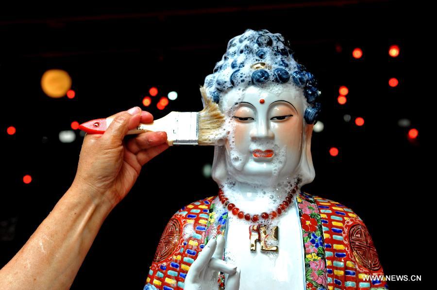 Buddha cleaned in Indonesia for the Chinese Lunar New Year