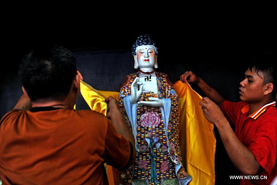 Buddha cleaned in Indonesia for the Chinese Lunar New Year