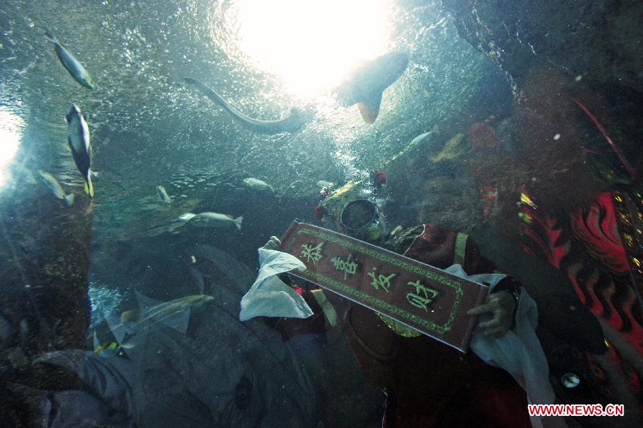 Visitors receive New Year blessing at Underwater World in Singapore