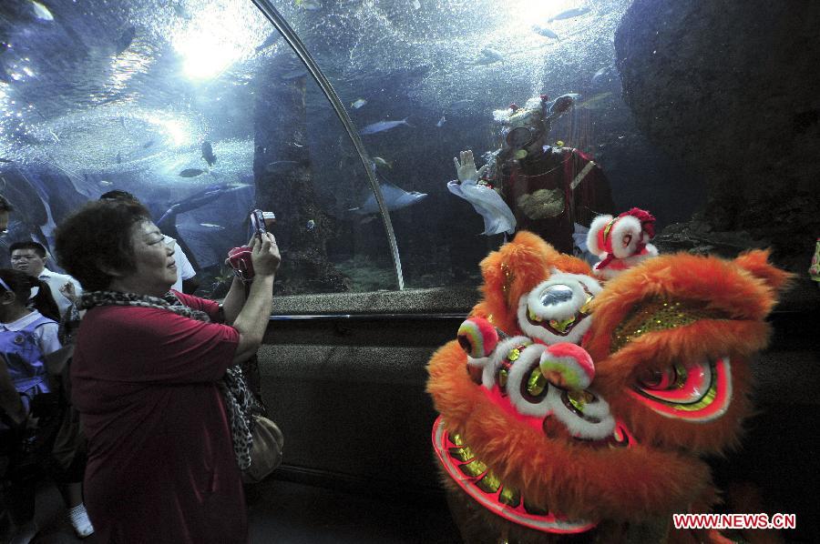 Visitors receive New Year blessing at Underwater World in Singapore