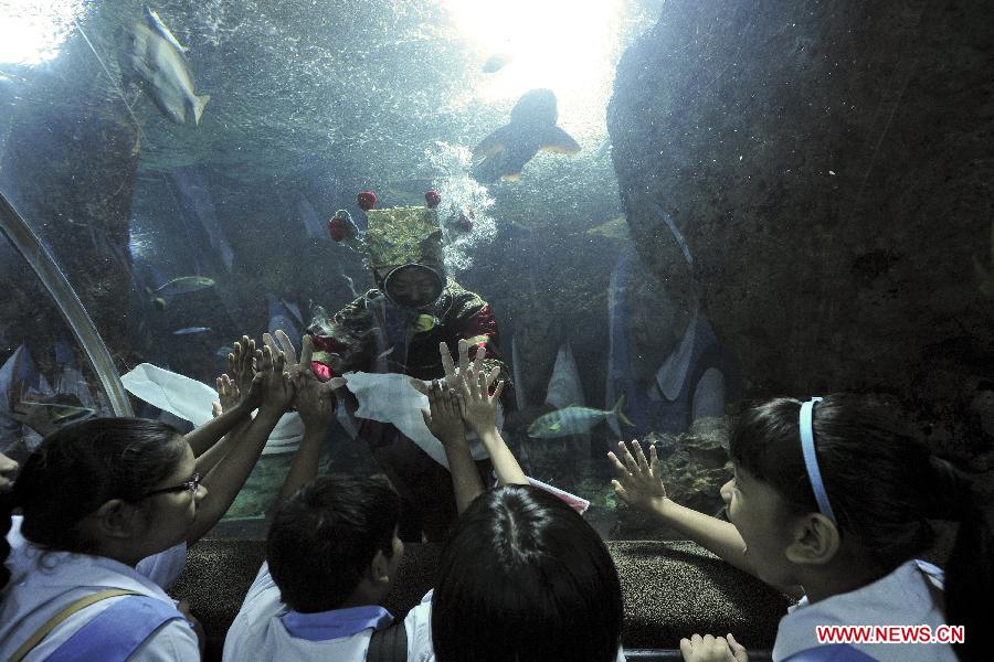 Visitors receive New Year blessing at Underwater World in Singapore