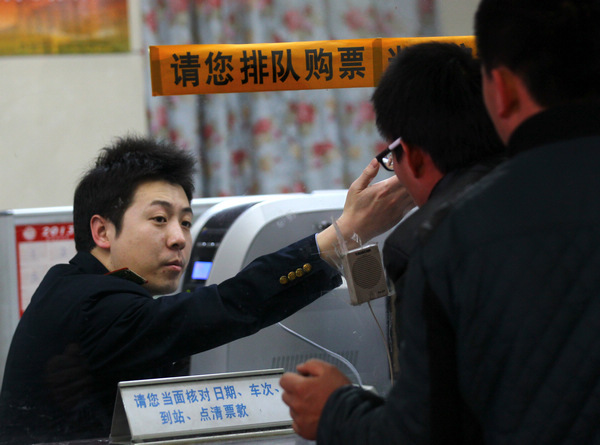 Li Tian, a ticket seller at Beijing Railway Station.