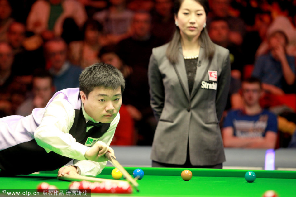 Ding Junhui of China hits a ball in the quarter-final of Welsh Open against Robert Milkins.
