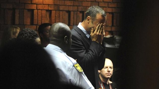 Oscar Pistorius weeps in court as he is charged in court with the murder of his girlfriend. 