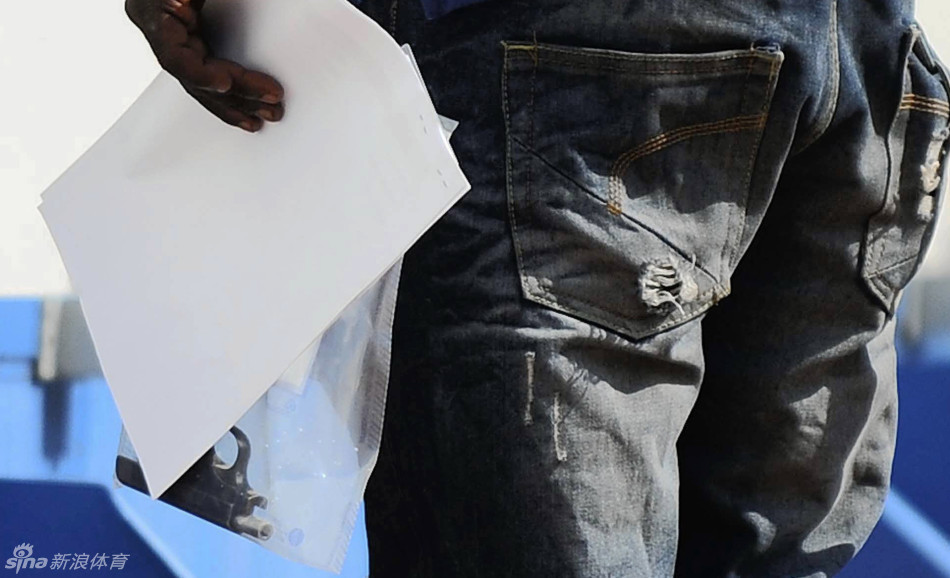 A police officer holds a gun that was allegedly used in the shooting of Steenkamp.