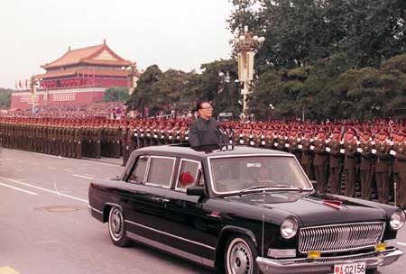 Former Chinese President Jiang Zemin travels in a Hongqi sedan to review troops at the 50th anniversay of the founding of the People's Republic of China on October 1, 1999. [Photo/ Xinhua] 