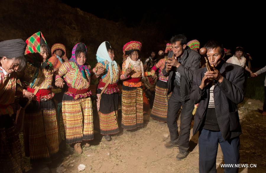 Participants of a traditional Lisu wedding attend an overnight group dance in Xinyu Village of Dechang County, southwest China's Sichuan Province, Feb. 15, 2013. 