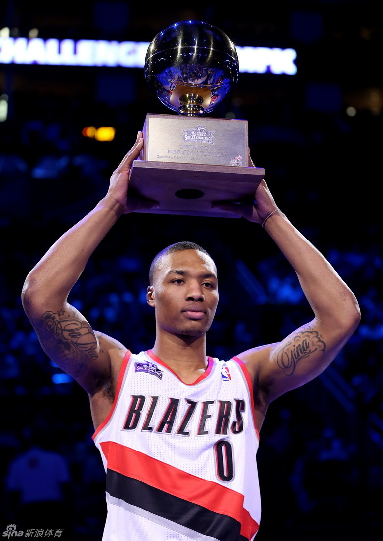  Portland Trailblazers guard Damian Laillard (0) is presented the trophy for winning the 2013 NBA All-Star skills challenge at the Toyota Center.