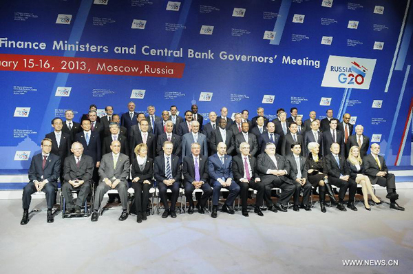 Participants pose for a group photo during the Group of 20 (G20) Meeting of Finance Ministers and Central Bank Governors in Moscow, Russia, Feb. 16, 2013. The two-day meeting concluded here on Saturday.