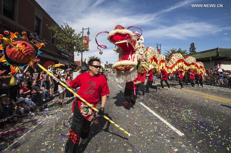 Dragon dancers perform during the 114th annual Chinese New Year 'Golden Dragon Parade' in the streets of Chinatown in Los Angeles, the United States, Feb. 16, 2013.