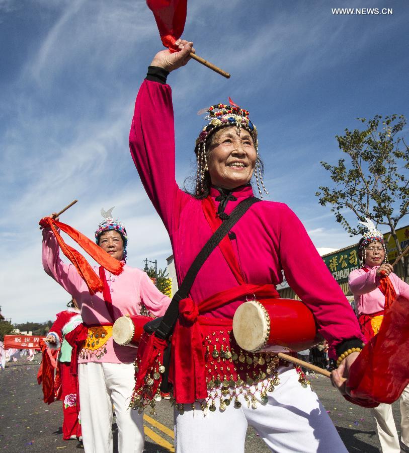 Traditional Chinese drum dancers perform during the 114th annual Chinese New Year 'Golden Dragon Parade' in the streets of Chinatown in Los Angeles, the United States, Feb. 16, 2013.