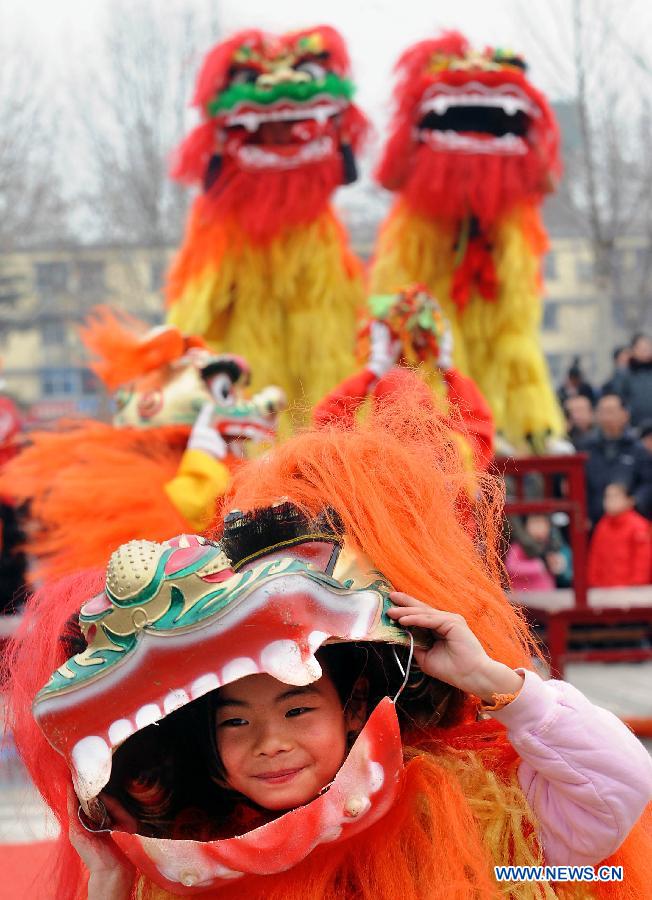 File photo taken on Feb. 27, 2010 shows a young folk artist attending a Lantern Festival Shehuo performance in Zhengzhou, capital of central China's Henan Province.