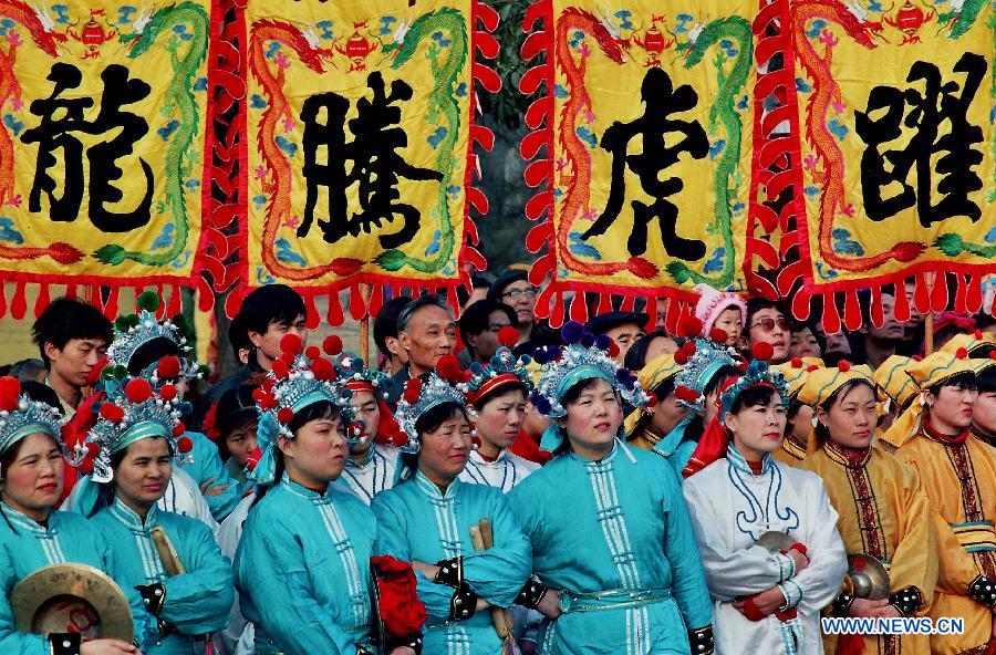 File photo taken on Feb. 27, 2010 shows a young folk artist attending a Lantern Festival Shehuo performance in Zhengzhou, capital of central China's Henan Province.