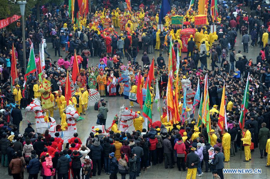 Performers perform Nuo dance, a kind of exorcising dance, during the 14th Folk Culture Festival in Liyang City, east China's Jiangsu Province, Feb. 17, 2013.