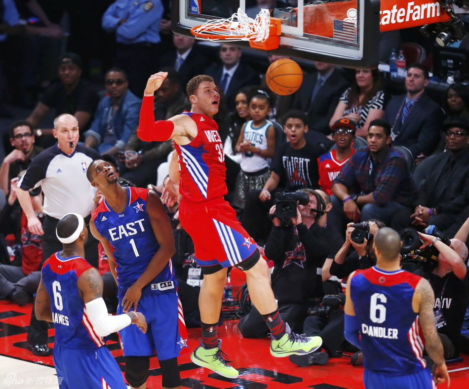 NBA All-Star Blake Griffin of the Los Angeles Clippers (32) dunks against All-Star Chris Bosh of the Miami Heat (1) during the 2013 NBA All-Star basketball game in Houston, Texas, February 17, 2013.