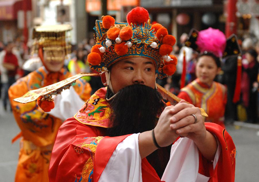 People parade during a Lunar New Year of the Snake celebration at Chinatown in Vancouver, Canada, Feb. 17, 2013. The grand parade is one of the largest in North America, drawing 70,000 people to the streets of Chinatown.