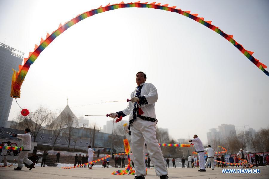 A man plays diabolo at a park in Lanzhou, capital of northwest China's Gansu Province, Feb. 19, 2013.