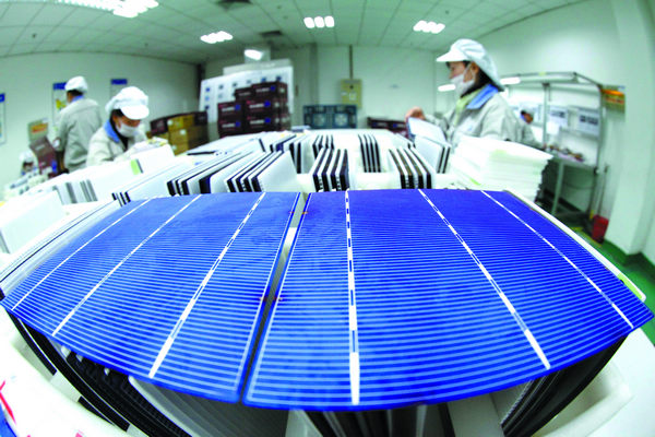 Technicians inspect solar-panel products ready for the European market in Ganyu, Jiangsu province. The European Union may impose anti-dumping tariff s on Chinese solar panels. [Photo/China Daily]