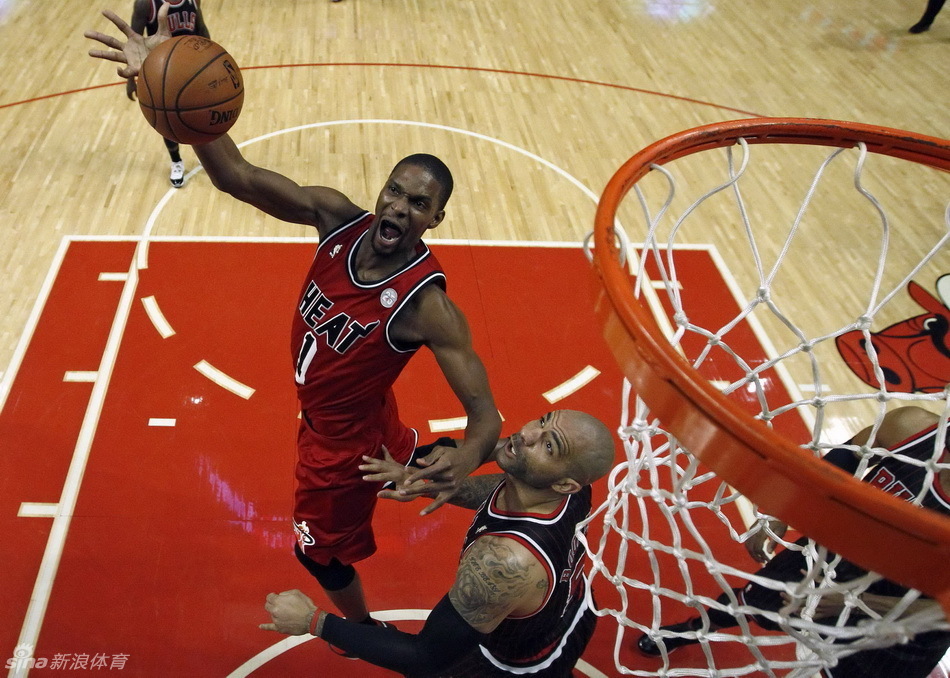 Chris Bosh and Carlos Boozer positioned for a rebound in a NBA game between Miami Heat and Chicago Bulls on Feb.21, 2013. 