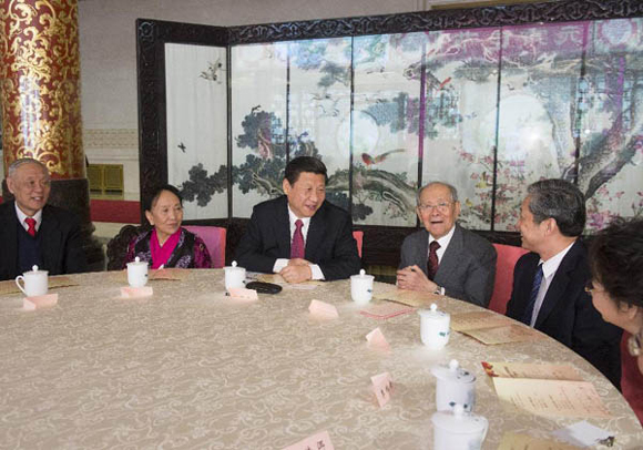 Xi Jinping (C), General Secretary of the CPC Central Committee, talks with noted intellectuals during a gala to celebrate the Lantern Festival at the Great Hall of the People in Beijing on Feb. 23, 2013.  