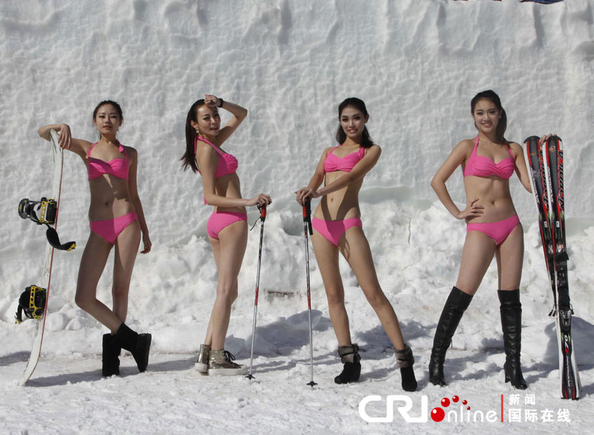 Contestants present ski equipment at the final of a beauty contest in Shenyang, capital of northeast China&apos;s Liaoning Province, Feb. 23, 2013.