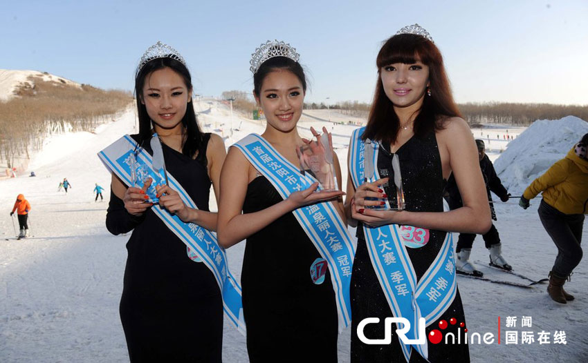 Contestants present ski equipment at the final of a beauty contest in Shenyang, capital of northeast China&apos;s Liaoning Province, Feb. 23, 2013.