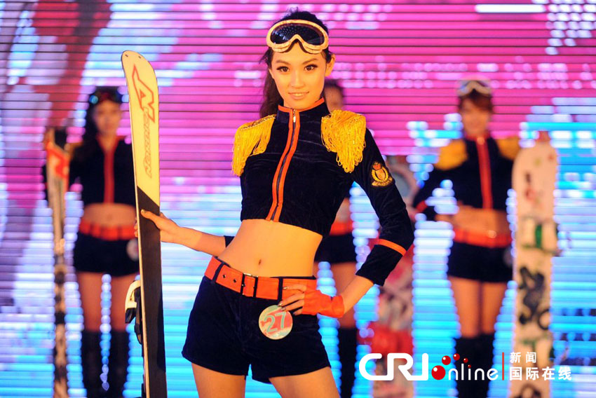 Contestants present ski equipment at the final of a beauty contest in Shenyang, capital of northeast China&apos;s Liaoning Province, Feb. 23, 2013.