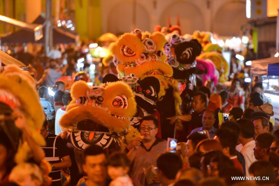 Malaysians perform lion dance to celebrate the traditional Chinese Lantern Festival in Malacca, Malaysia, on Feb. 24, 2013. 