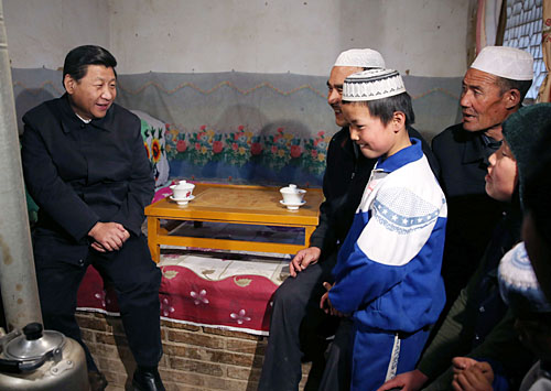 Xi Jinping, General Secretary of the Central Committee of the Communist Party of China, visits the home of impoverished villager Ma Maizhi on February 3. Xi presented school supplies to Ma's children in the Bulenggou Village of the Dongxiang Autonomous County, northwest China's Gansu Province [Lan Hongguang/Xinhua]