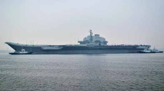 China's aircraft carrier anchors in military port