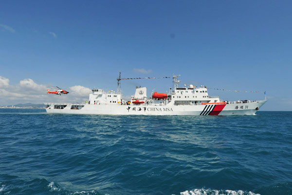 Marine patrol ship Haixun 31 sails out of the port of Sanya, South China's Hainan Province, Feb 28, 2013.