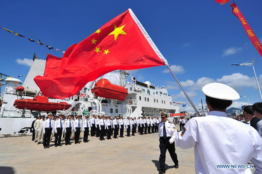 Marine patrol staff members get ready to conduct a coast guard mission at the port of Sanya, south China&apos;s Hainan Province, Feb. 28, 2013. 