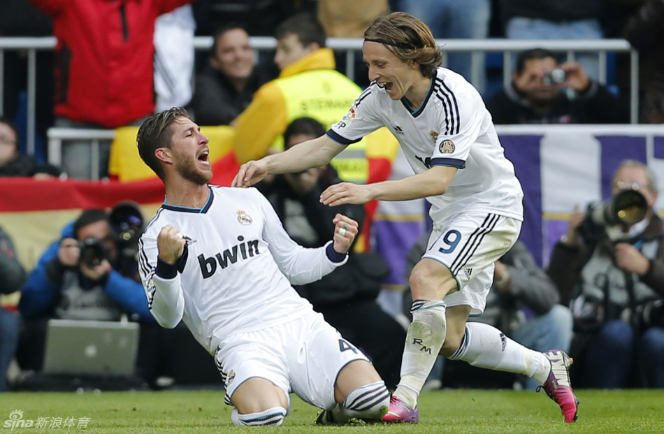 Sergio Ramos celebrates with Luka Modric, who swung in the corner for the winning goal.