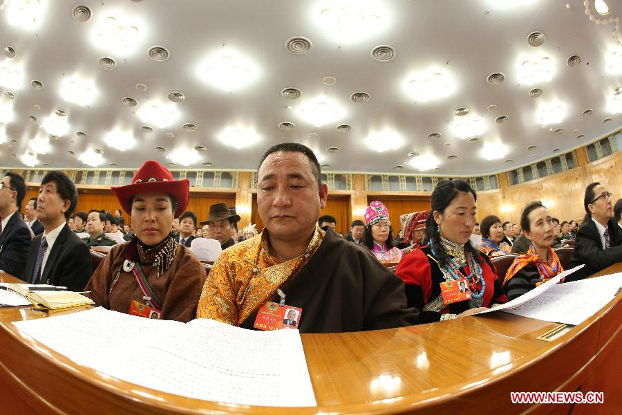 Members of the 12th National Committee of the Chinese People's Political Consultative Conference (CPPCC) attend the opening meeting of the first session of the 12th CPPCC National Committee at the Great Hall of the People in Beijing, capital of China, March 3, 2013. 