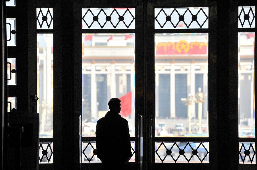 A security man stands guard in the Great Hall of the People in Beijing, capital of China, March 3, 2013. 